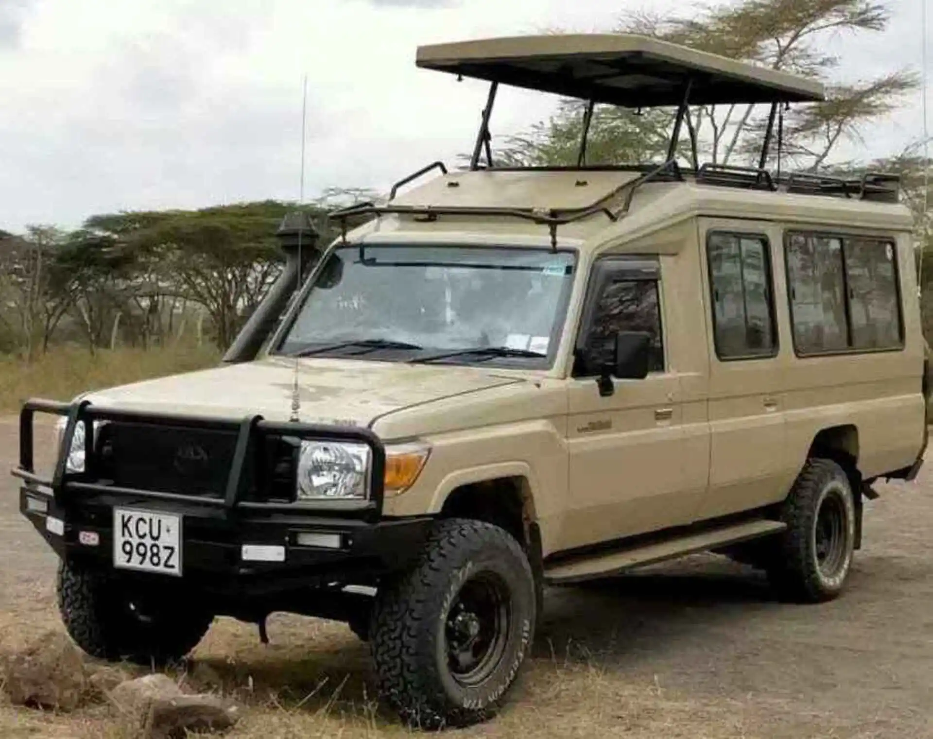 pop up roof land cruiser ready for hiring and renting for trips or safaris, Is It Safe to Rent a Car in Uganda